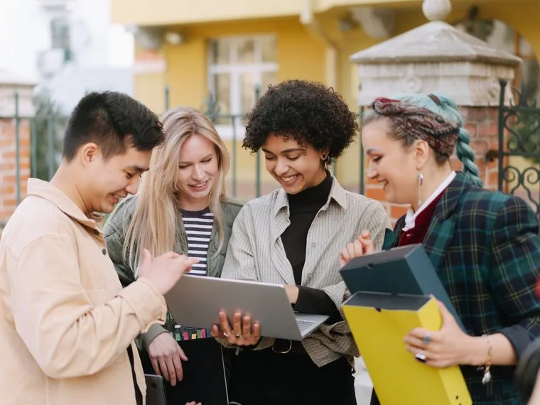 A nonprofit team reviewing their strategy together on a laptop