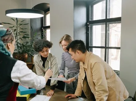 A team reviewing design materials and samples together